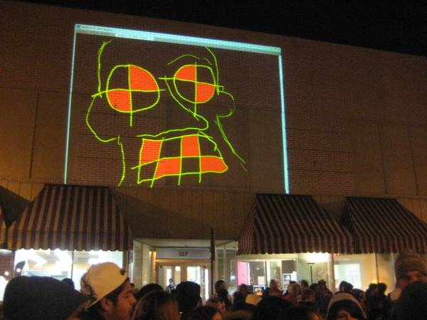 Cory Peak artwork at Shine Live Drawing Projection Exhibit - Muscatine Holiday Stroll